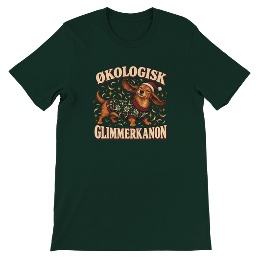 Unisex jule-T-shirt med en gravhund i grøn julesweater, flyvende hundehår og teksten “Økologisk glimmerkanon”.